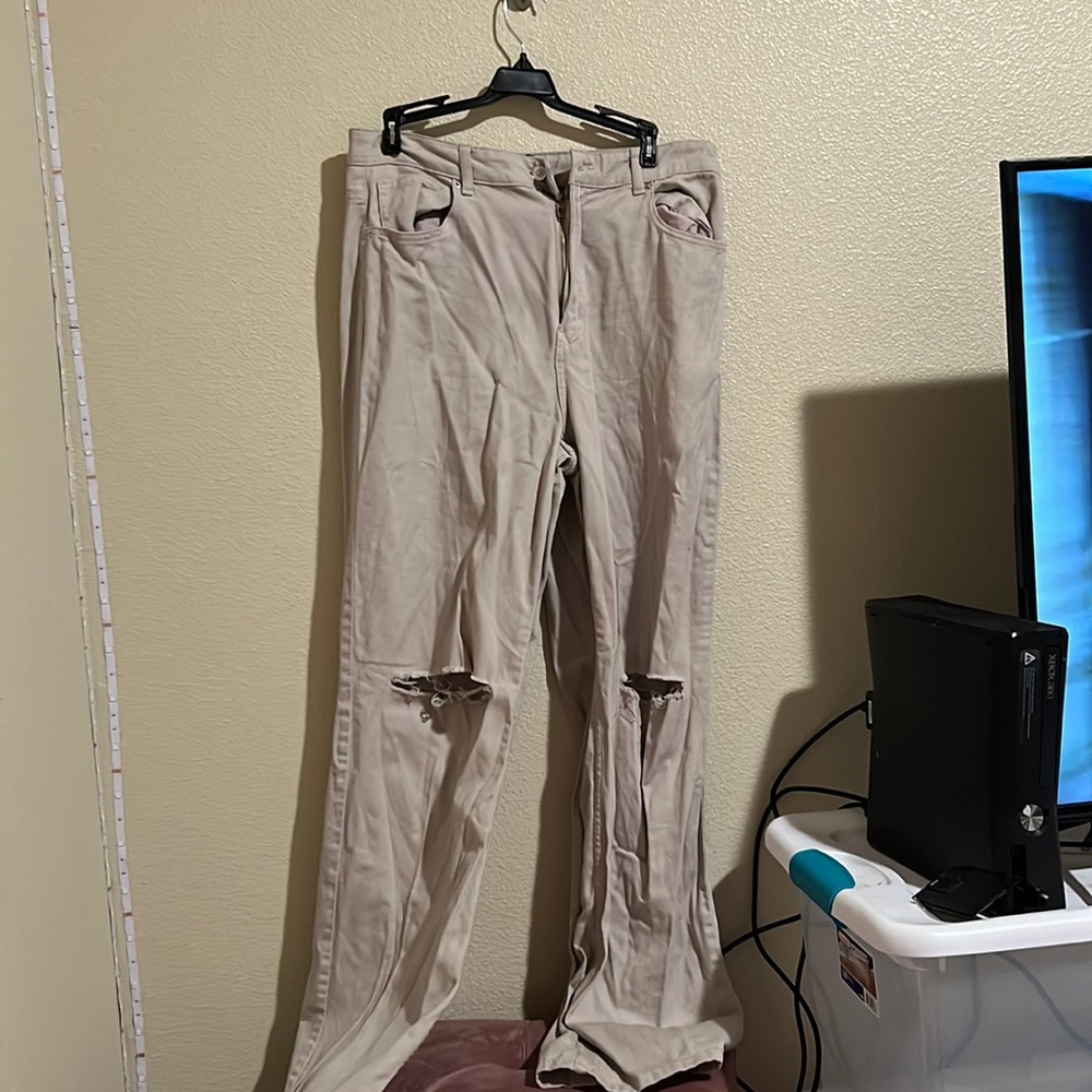 Tan oversized jeans with rips